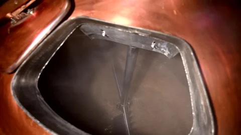 Craft Brewery Slow Motion Brewing Process Showing Hops and Malt in the Tank Stock Footage 323918393