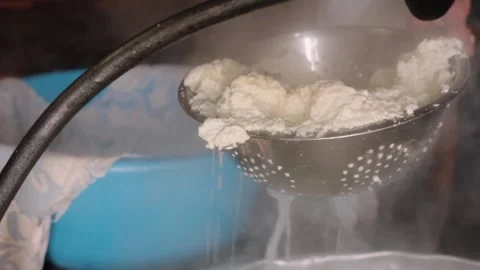 Craft cheese being made by hand in rustic setting Video stock 307136061