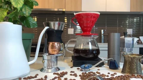 Craft coffee ad In foreground coffee beans are scattered on the table Different Stock Footage 220697704