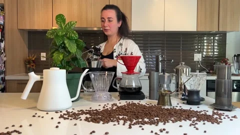 Craft coffee ad In foreground coffee beans are scattered on the table Different Stock Footage 220697749