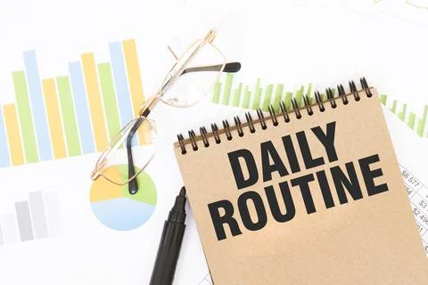 In a craft colour notebook is a DAILY ROUTINE inscription, next to pencils,.. Foto stock