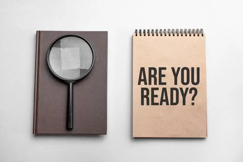 Craft colour notepad with text ARE YOU READY. Notepad with , magnifying glass Stock Photos