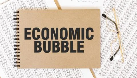 Craft colour notepad with text ECONOMIC BUBBLE. Notepad with eyeglasses and.. Stock Photos