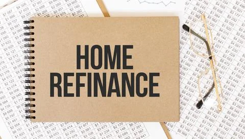 Craft colour notepad with text Home refinance. Notepad with eyeglasses and te Stock Photos