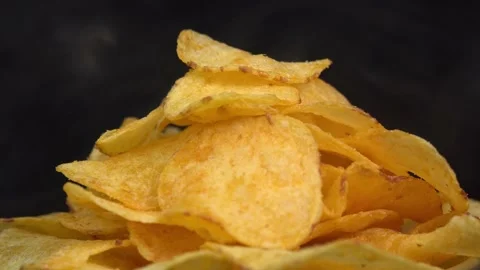 Craft crispy hot potato chips with smoke rotating on Stock Footage 196830518