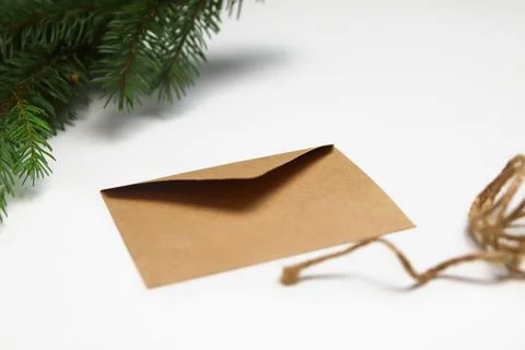 Craft eco envelope on white background. Christmas holiday concept. Letter to  Stock Photos