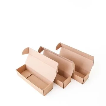 Craft empty boxes are open on a white background. Place for text and logo. .. Stock Photos