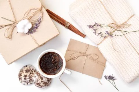 Craft envelope, gift box with bow, knitted scarf, dried flowers and leaves, c Stock Photos