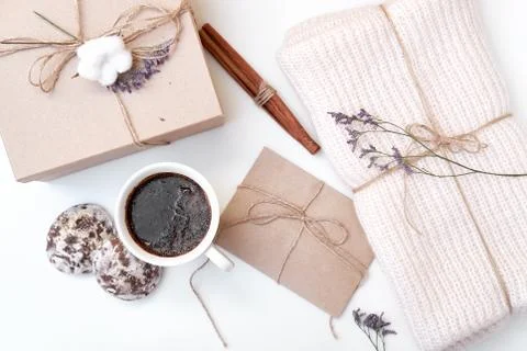 Craft envelope, gift box with bow, knitted scarf, dried flowers and leaves, c Stock Photos