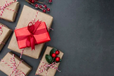 Craft gift boxes over dark background. Christmas mock up with copy space. Win Stock Photos
