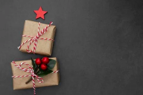 Craft gift boxes over dark background. Christmas mock up with copy space. Win Stock-Fotos