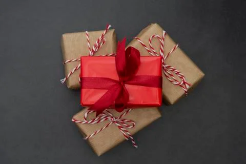 Craft gift boxes over dark background. Christmas mock up with copy space. Win Stock Photos