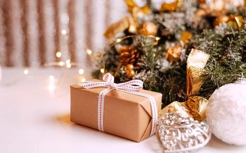 Craft gifts under the tree, on the table. The concept of Christmas and New Year. Stock Photos
