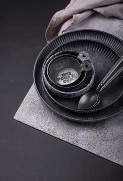 Craft iron tableware in grey background Stock Photos