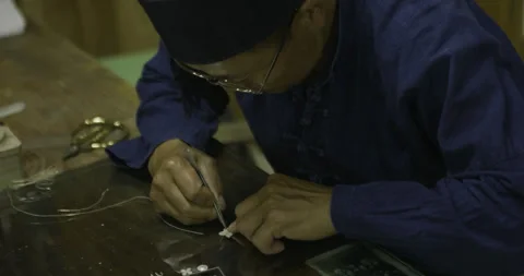 Craft-master making small silver product Stock Footage 141356679