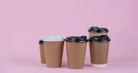 Craft paper coffee cups of different sizes dancing stop motion animation 4k  Stock Footage 231676888