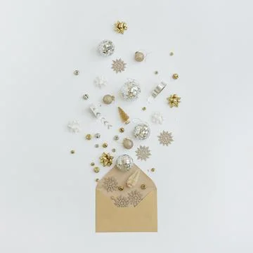 Craft paper envelope with Christmas tree decorations, balls, stars, ribbons o Stock Photos