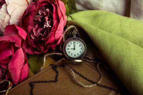 Craft paper note with cup of tea, flowers, peonies, old vintage clock. Retr.. Stock Photos