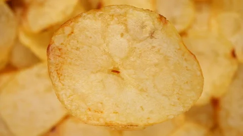 Craft potato chips top view, rotating Stock Footage 222378372