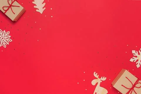 Craft present with baubles on red background Stock Photos
