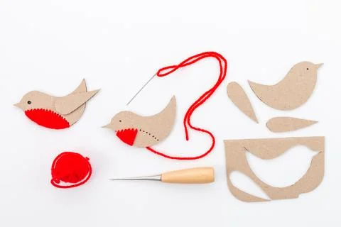 Craft project featuring bird shape made from brown cardboard, separate parts Stock Photos