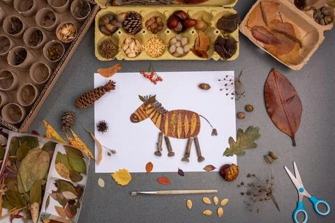 A craft project on a flat surface. At the center is a zebra creatively deco.. Stock Photos
