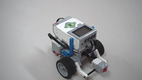 Craft for robotics class. Robot car made from LEGO construction kits and motors Stock Footage 258903156