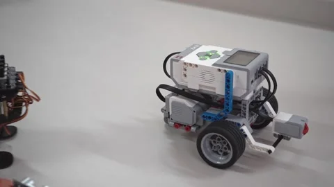 Craft for robotics class. Robot car made from LEGO construction kits and motors Stock Footage 261435052