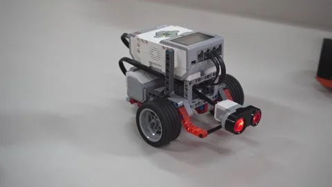 Craft for robotics class. Robot car made from LEGO construction kits and motors Stock Footage 262259534