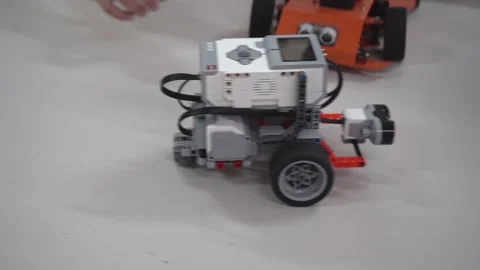 Craft for robotics class. Robot car made from LEGO construction kits and motors Stock Footage 262976805