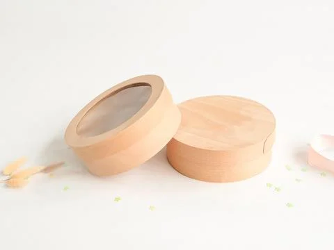 Craft round boxes on a festive background. Top view, place for text and log.. Stock Photos