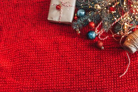 Craft rustic present on knitted red background Stock Photos