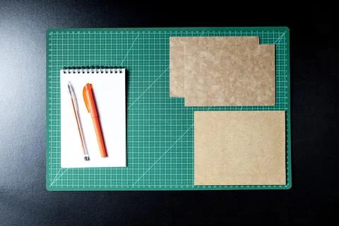 Craft table with clipboard, note sticker pen, pencil, paper scissors and card Stock Photos