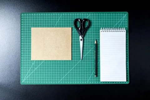 Craft table with clipboard, note sticker pen, pencil, paper scissors and card Stock Photos