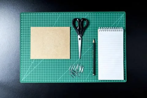 Craft table with clipboard, note sticker pen, pencil, paper scissors and card Stock Photos