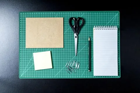 Craft table with clipboard, note sticker pen, pencil, paper scissors and card Stock Photos