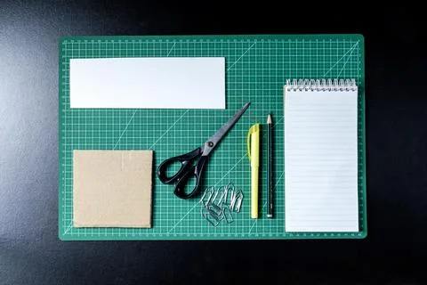 Craft table with clipboard, note sticker pen, pencil, paper scissors and card Stock Photos