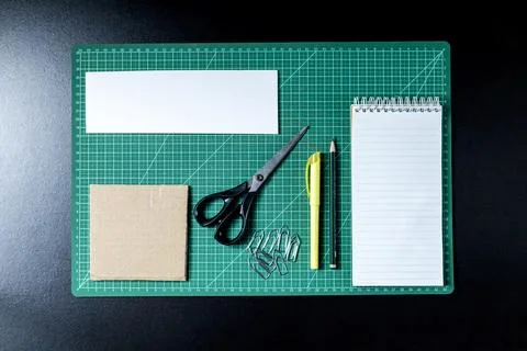 Craft table with clipboard, note sticker pen, pencil, paper scissors and card Stock Photos