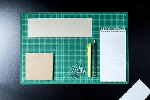 Craft table with clipboard, note sticker pen, pencil, paper scissors and card Stock Photos