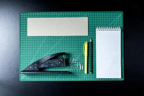 Craft table with clipboard, note sticker pen, pencil, paper scissors and card Stock Photos