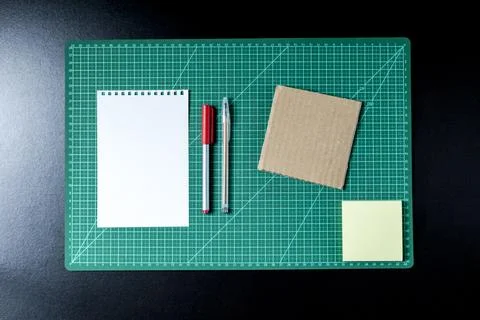Craft table with clipboard, note sticker pen, pencil, paper scissors and card Stock Photos