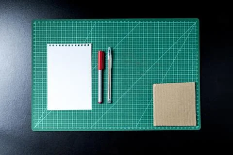 Craft table with clipboard, note sticker pen, pencil, paper scissors and card Stock Photos