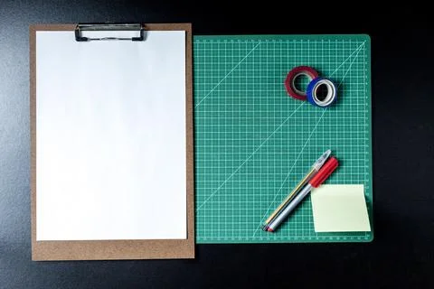 Craft table with clipboard, note sticker pen, pencil, paper scissors and card Stock Photos