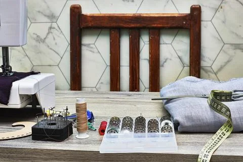 Craft Table With Sewing Tools, Spools, Tape Measure, And Needlework Supplies Stock Photos