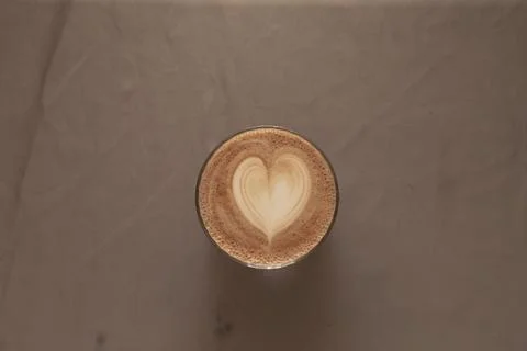 Crafted coffee presentation featuring symmetrical latte art and calm ambiance Stock Photos