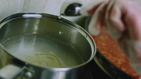 Crafted culinary study of chili con carne and rice cooking side by side Stock Footage 342153464