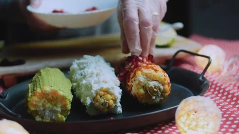 Crafted food study: finishing corn with grated cheese Stock Footage 342172071
