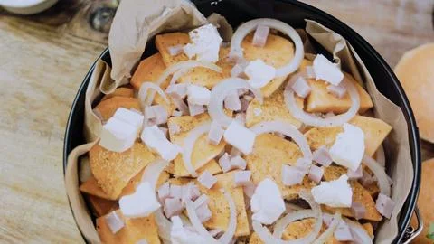 Crafted overhead composition: arranging the mixture in a baking dish Stock Photos