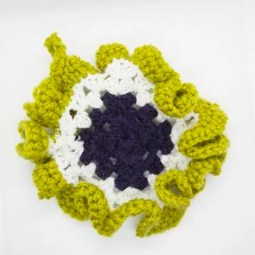 Crafted pot holder for the kitchen Stock Photos