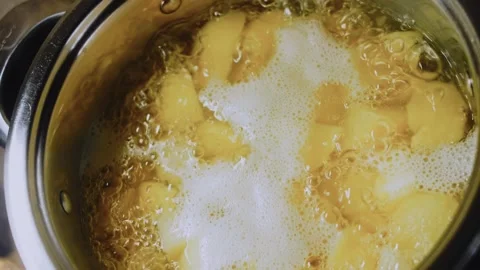 Crafted savory arrangement: boiling potatoes until tender Stock Footage 342195960